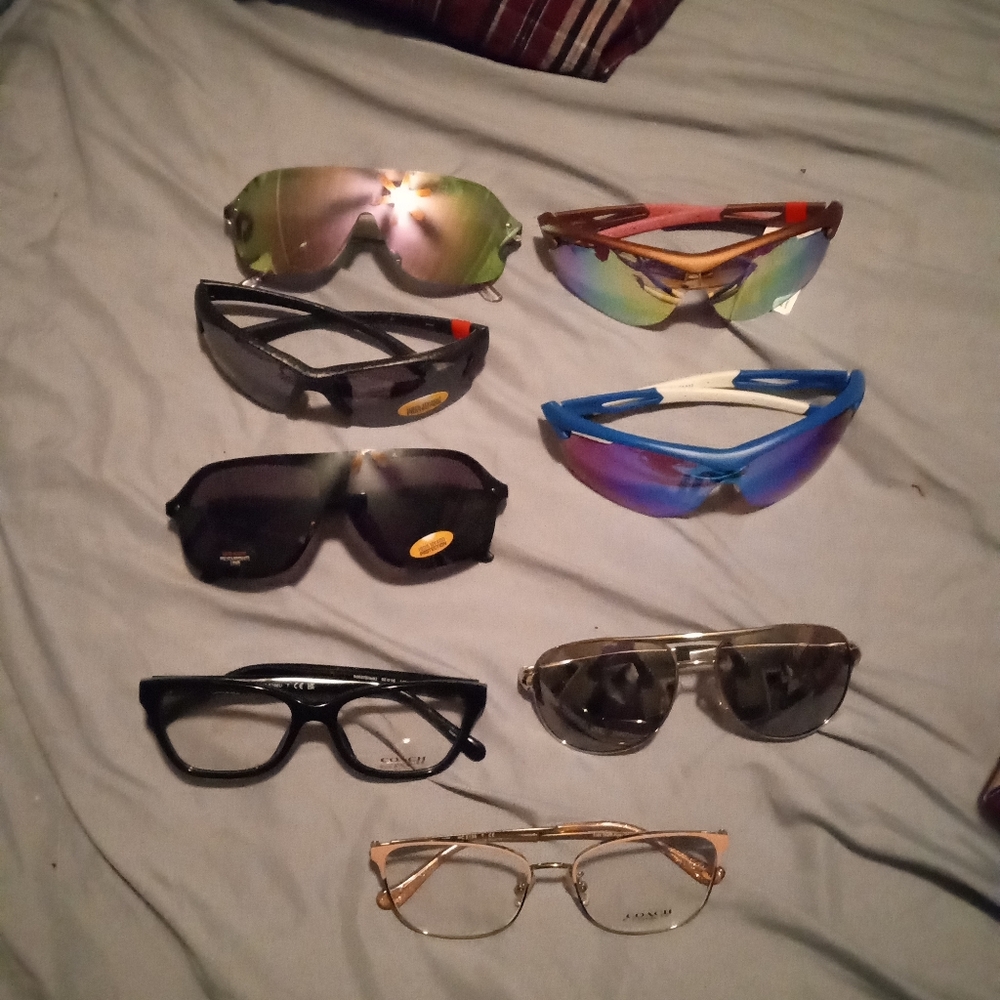 11 pair of active sport sunglasses originally $45 a piece and two coach $120 ea